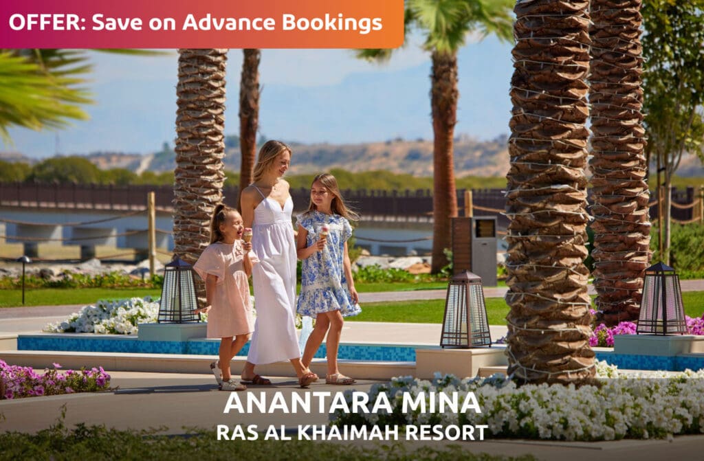 OFFER: Save on Advance Bookings at Anantara Mina Ras Al Khaimah Resort - woman and two girls walking a palm-lined garden path